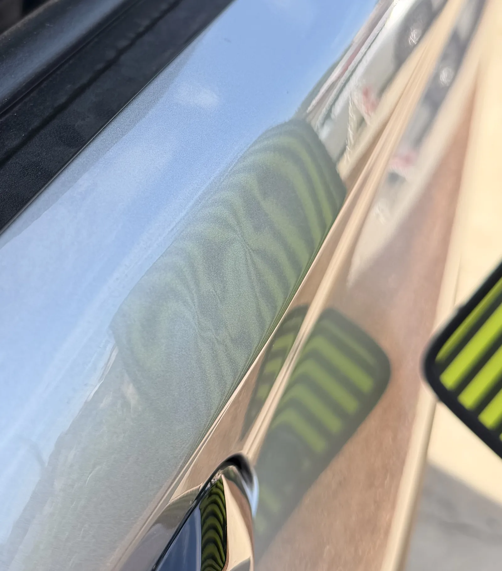 Line board reflection bending in waves over a fender after a customer glue puller and screwdriver attempt