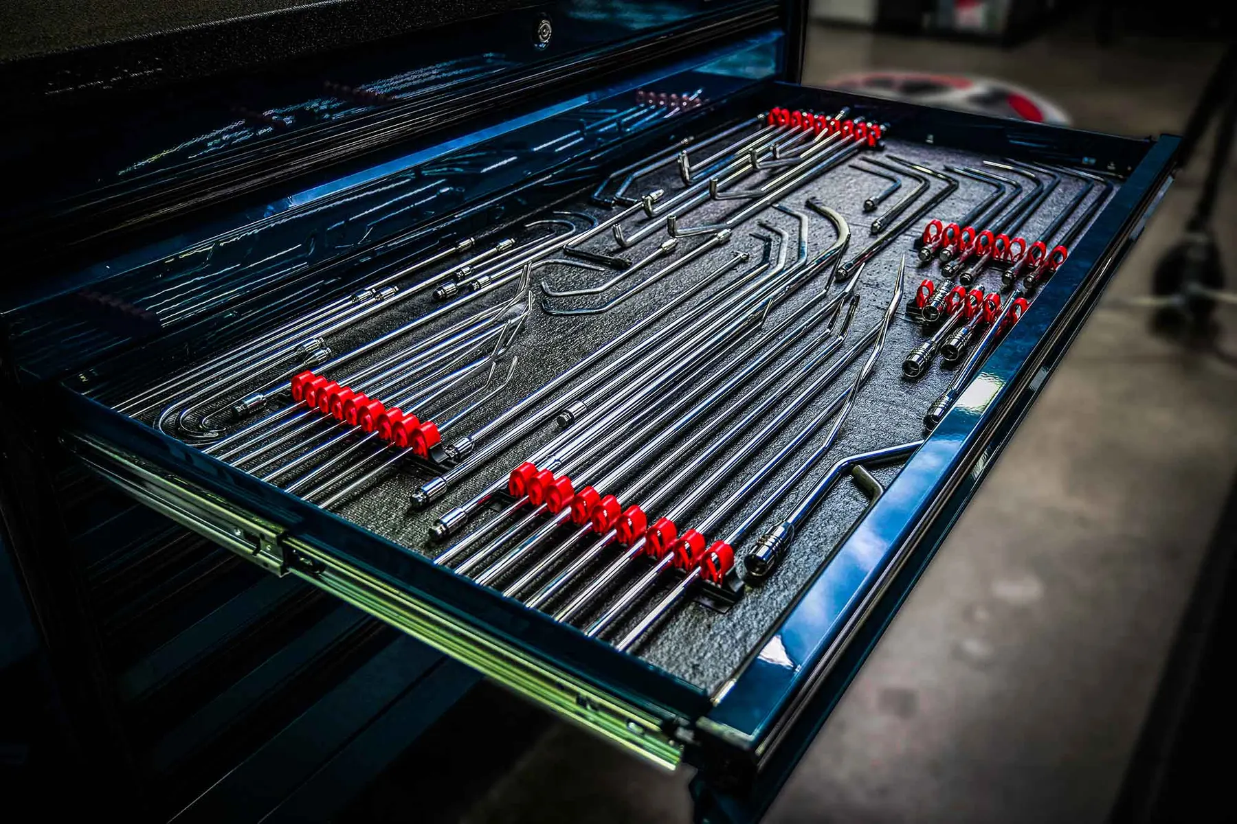 Paintless dent repair rods and tips laid out in the Dent Time shop in Escondido