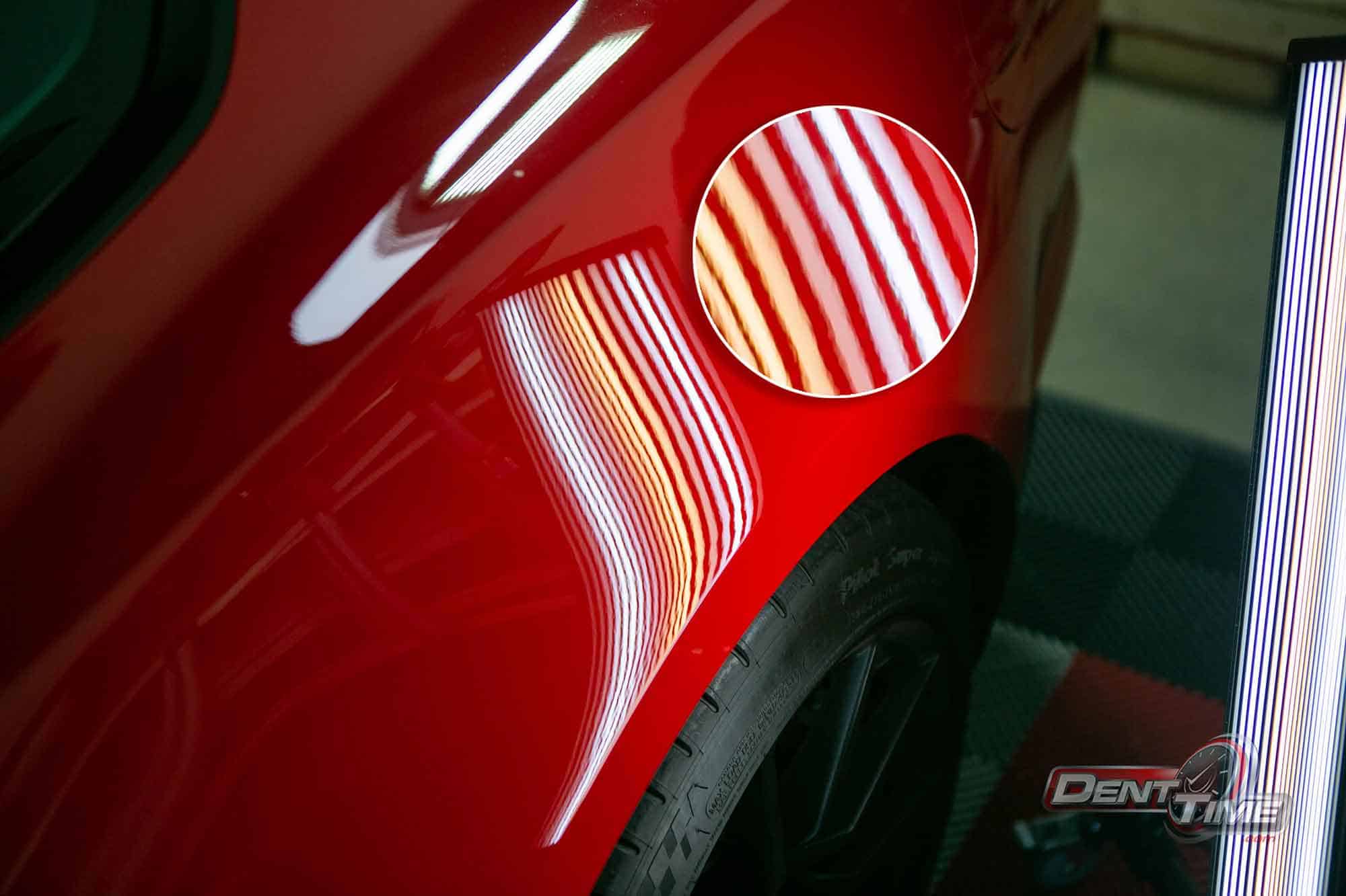Panel after paintless dent repair, reflection-board lines perfectly straight, San Diego