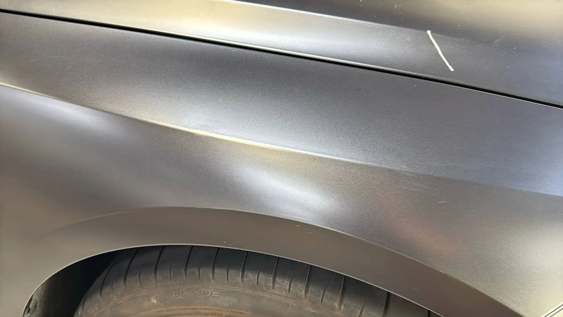 BMW fender after paintless dent repair, body line restored