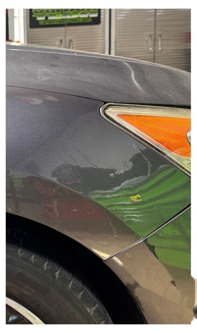 A repaired fender after a Practical paintless dent repair