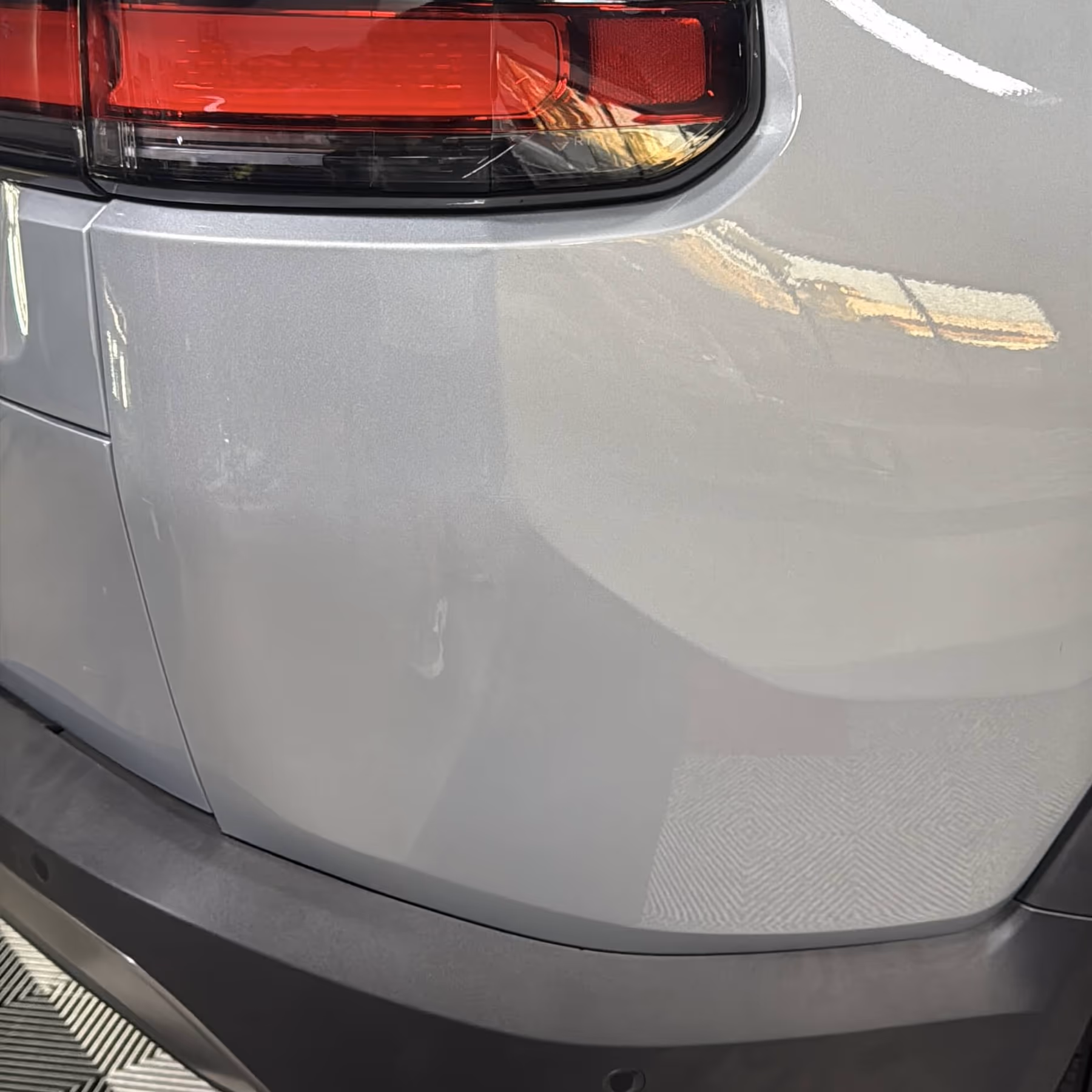 Rivian R1S rear quarter after paintless dent repair