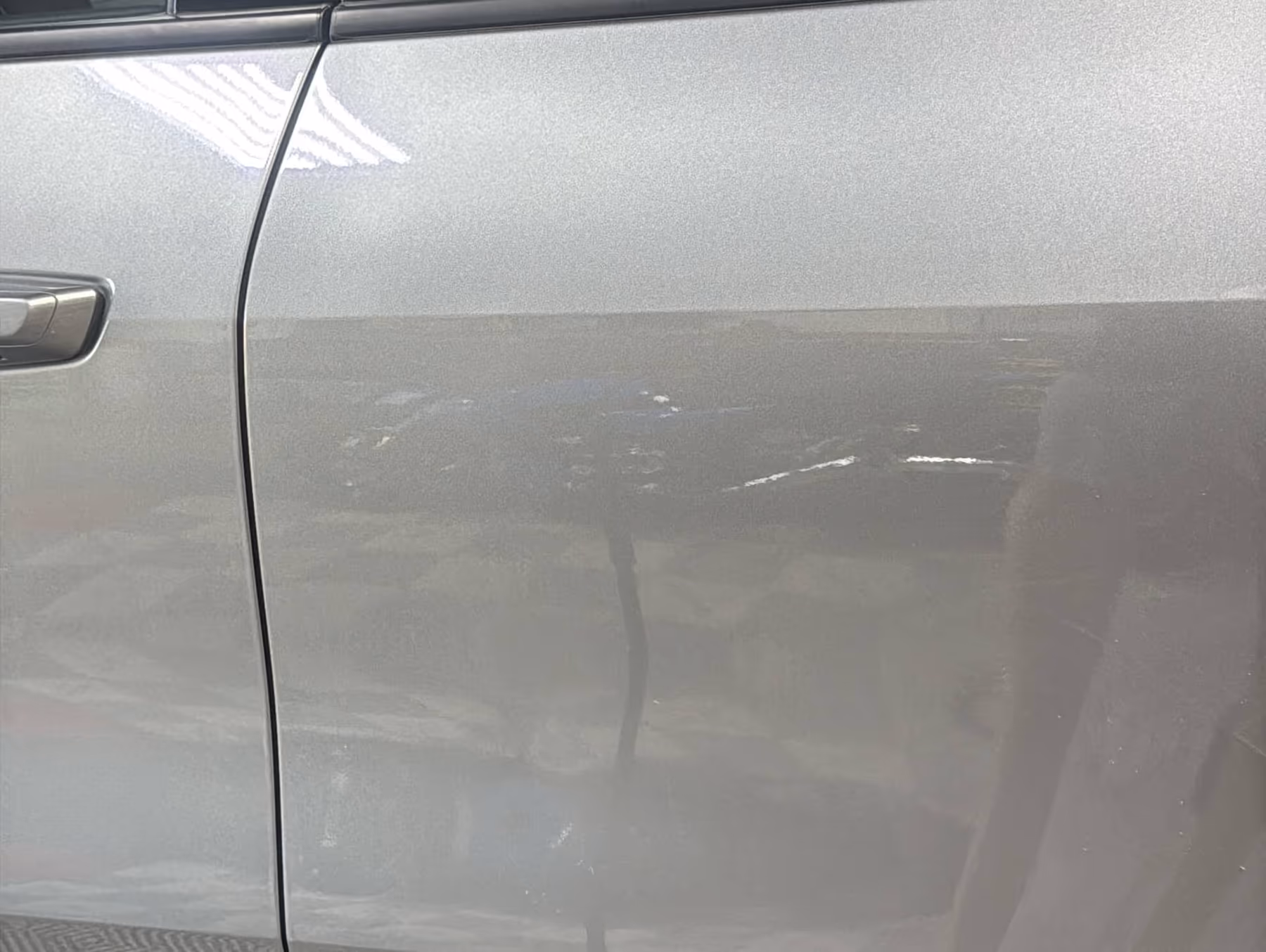 Chevy Traverse driver door after paintless dent repair