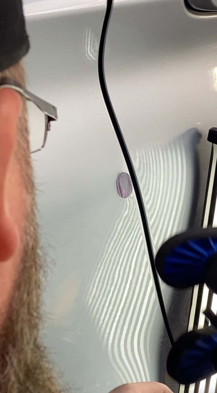 pdr technician working bmw quarter panel escondido shop