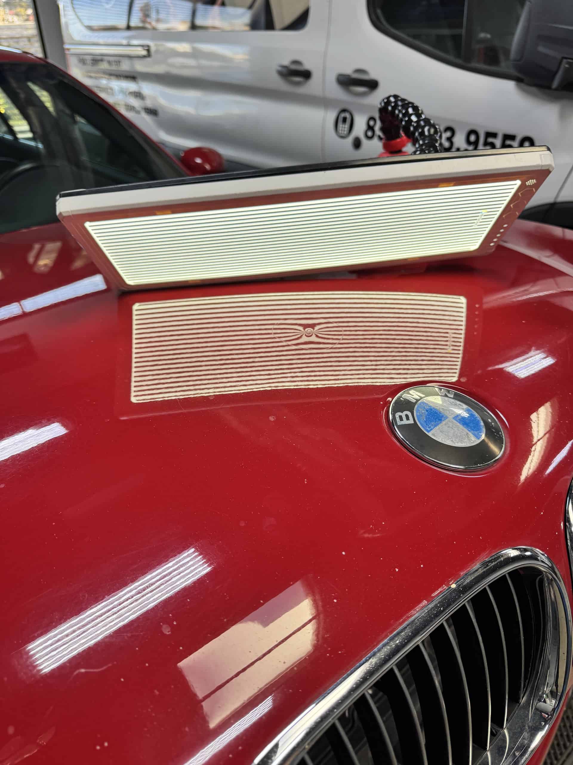 BMW dent repair San Diego - hood damage assessment