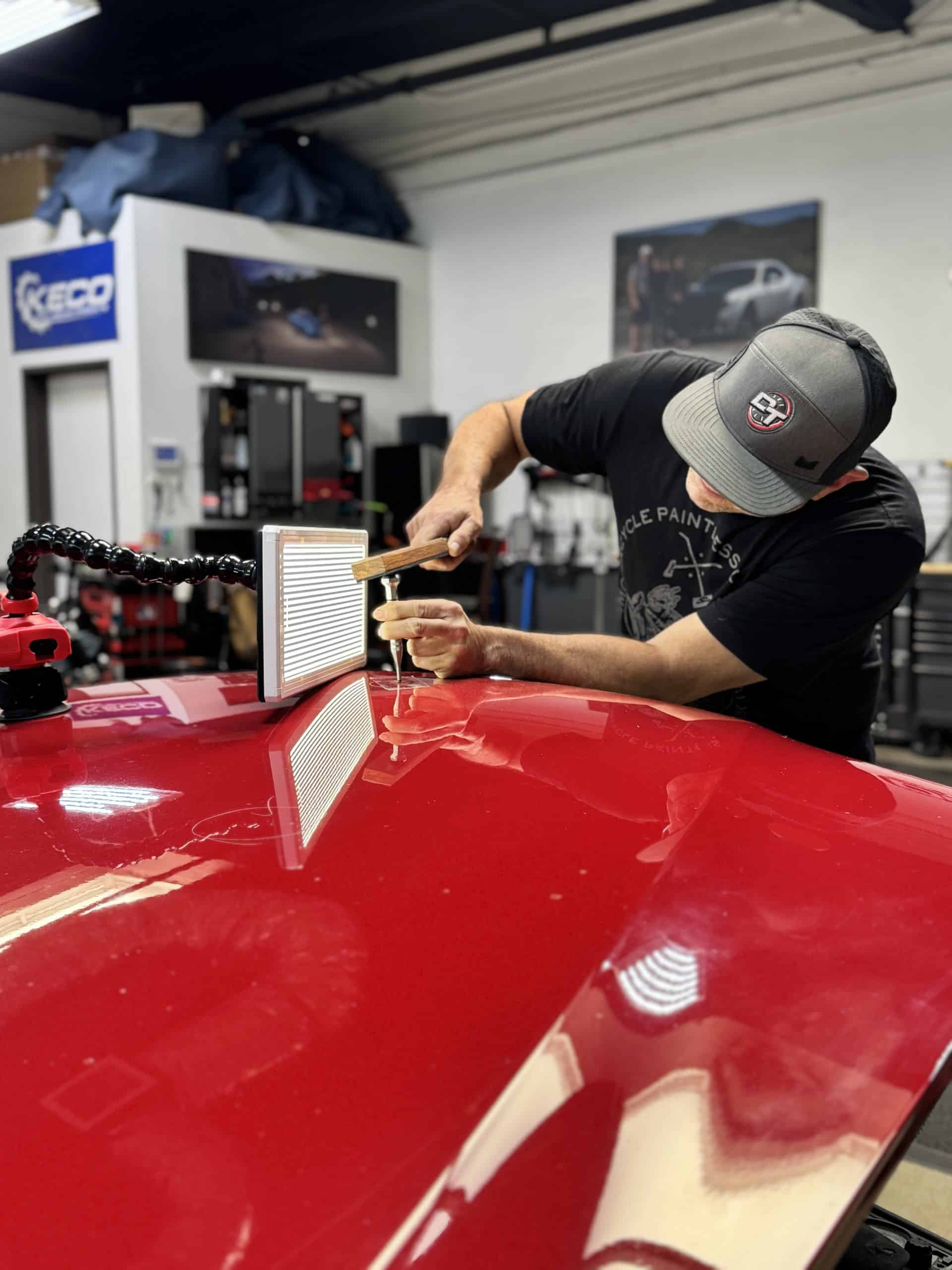 BMW dent repair high spot tapping technique in action